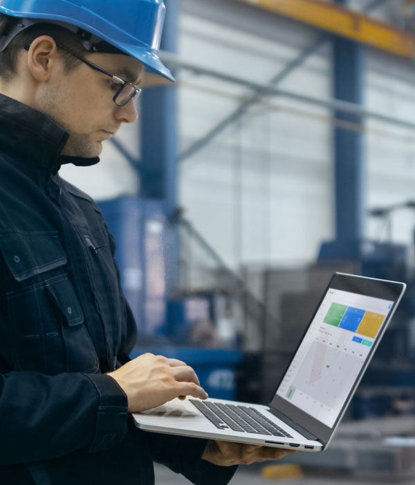 Man with helmet using QPass in his laptop