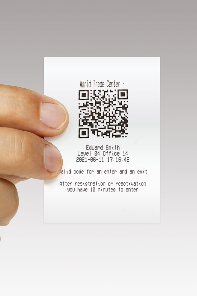 Hand showing a paper ticket with QPass Code
